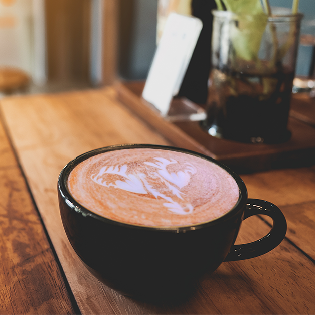 Latte art on a warm cup of coffee, showcasing an elephant to represent BEVAS Focus