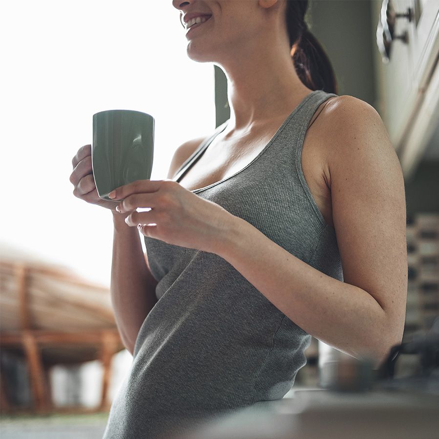 Athletic woman drinking BEVAS coffee in the morning for her gut health