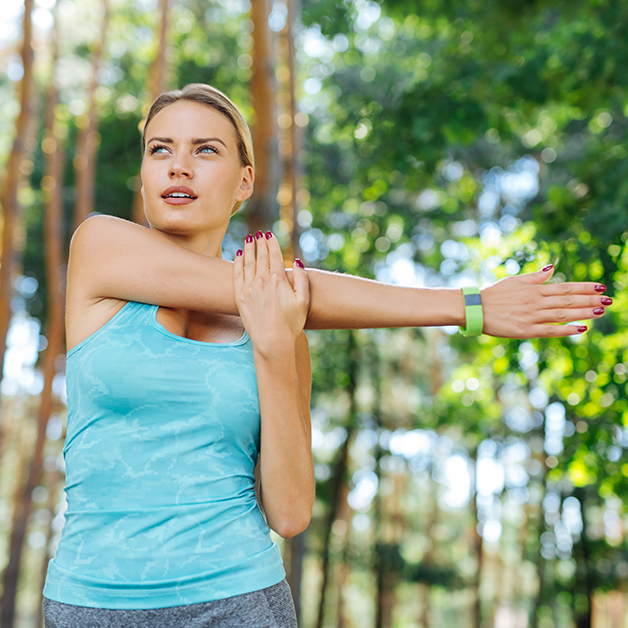 Athletic woman stretching, getting ready to start her day with energy